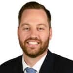 A professional male mortgage advisor smiling, promoting Future Home Loans’ personalized home loan solutions for new and existing homeowners.