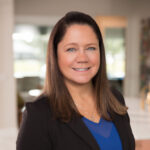 Professional woman in a black blazer.