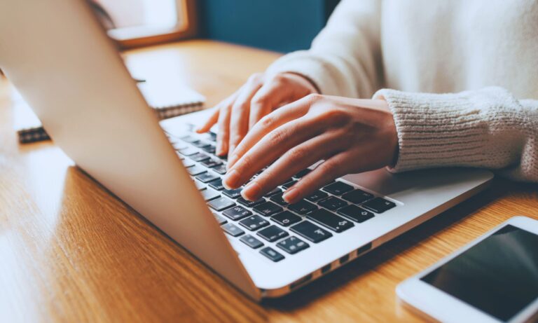 attending webinar on laptop