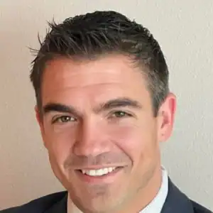 Man in suit against plain background